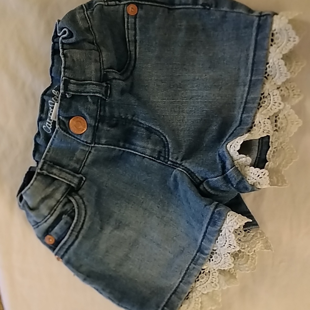 Blue denim shorts with white lace trim